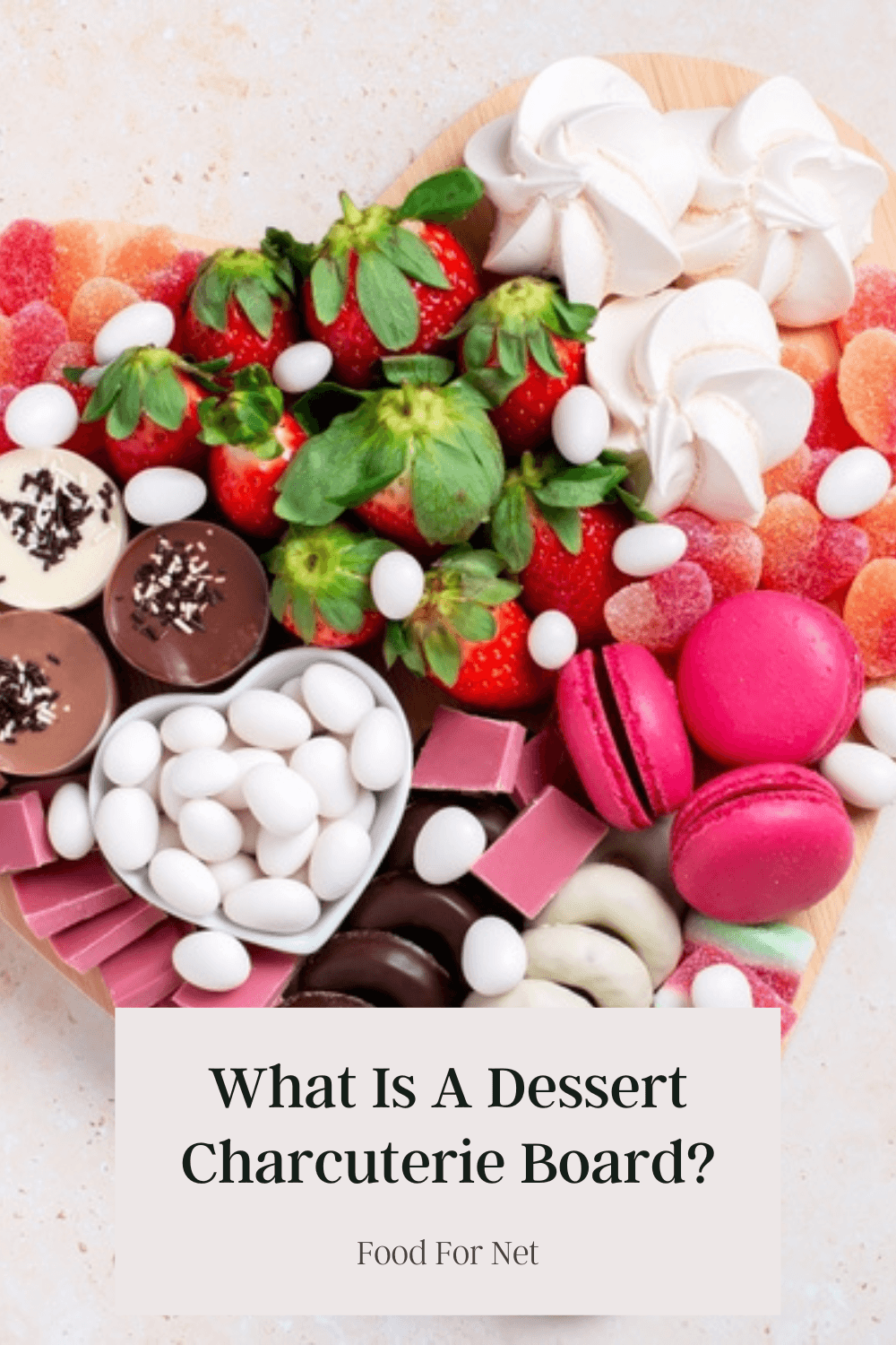 A heart shaped board filled with sweet treats, highlighting the question of: what is a dessert charcuterie board?