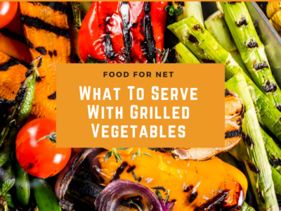 A grill with a collection of brightly colored grilled vegetables, including carrots, pepper, tomato, and asparagus, highlighting the question of what to serve with grilled vegetables