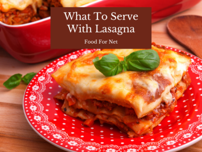 A square piece of lasagna on a red plate, looking at what to serve with lasagna