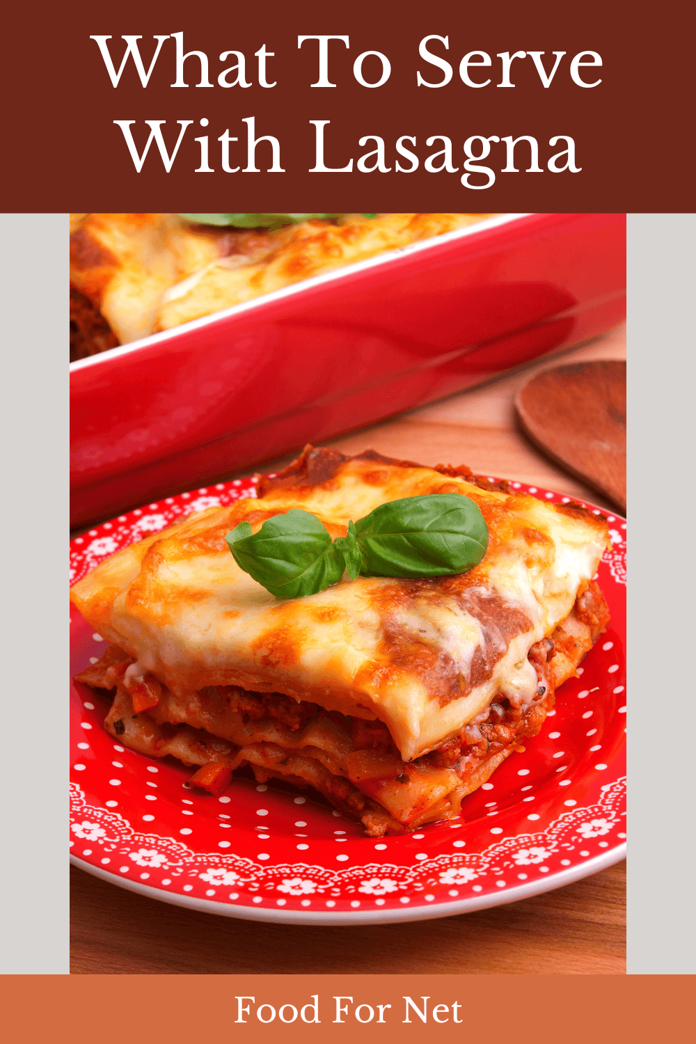 A square piece of lasagna on a red plate, looking at what to serve with lasagna