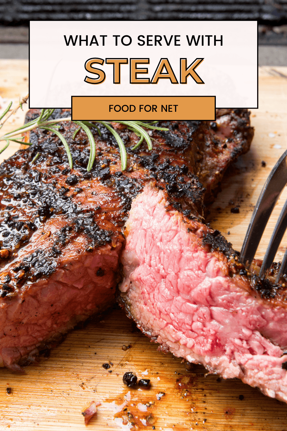 A piece of steak that has been cut, where someone is pulling away some of it with a fork, highlighting the question of what to serve with steak