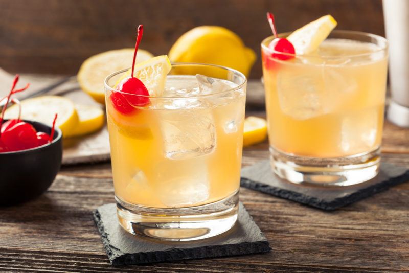 Two whiskey sour cocktails on a table