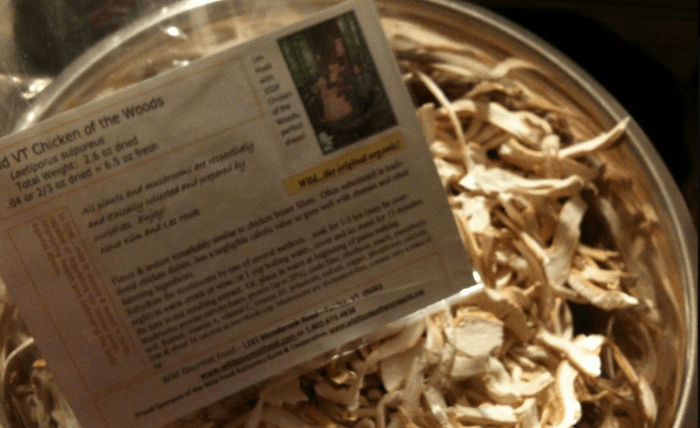 A container of dried mushrooms from Wild VT with an information card