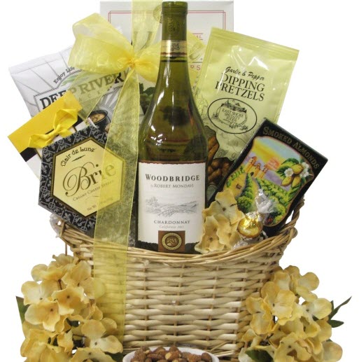 Woodbridge Chardonnay Wine Gift Basket | Food For Net A pale basket with yellow flowers and snacks.