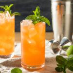 Two glasses of a zombie cocktail with ice
