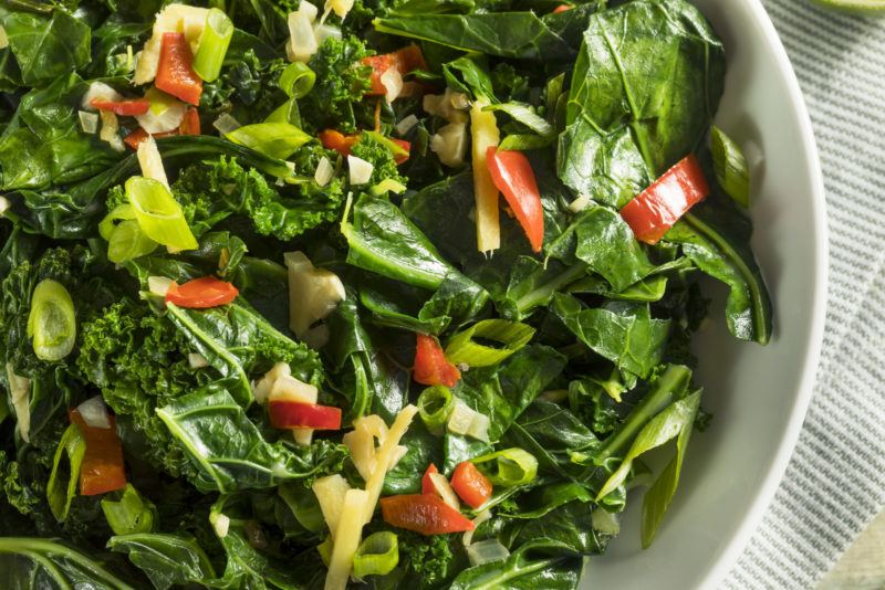 different types of leafy greens served in a salad bowl