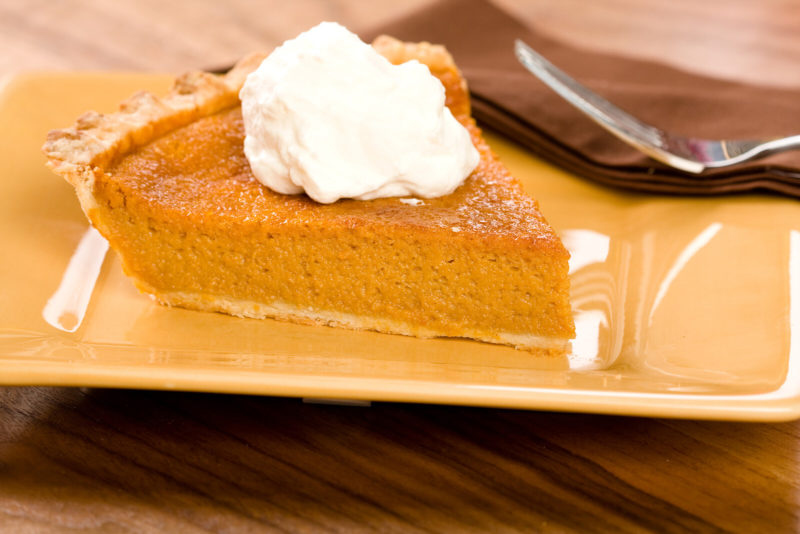 a slice of sweet potato pie with whipped cream | Food For Net a slice of sweet potato pit with a dollop of whipped cream, on a yellow square plate