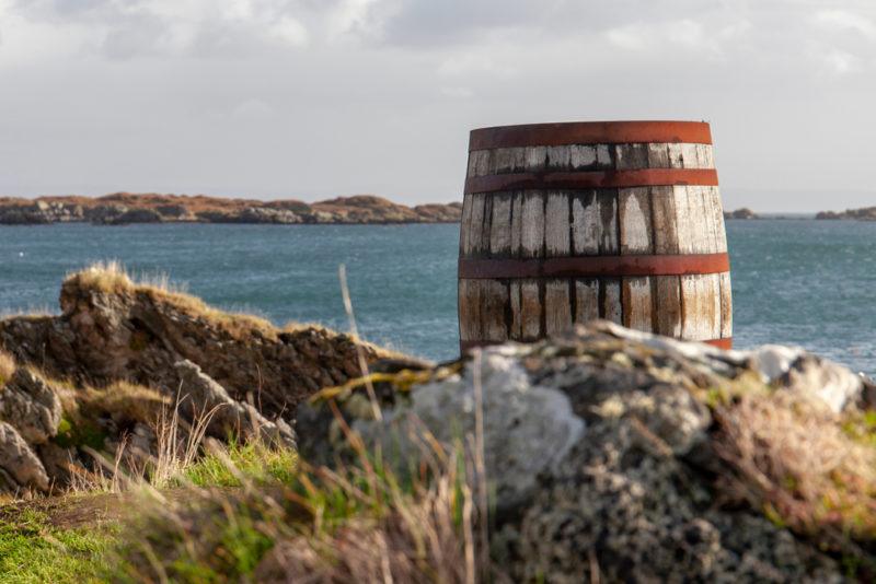 ardbeg whisky barrel at port ellen with sea in background