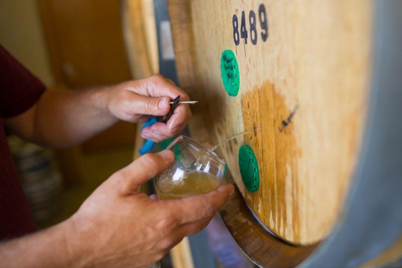 beer aging in used whiskey barrels