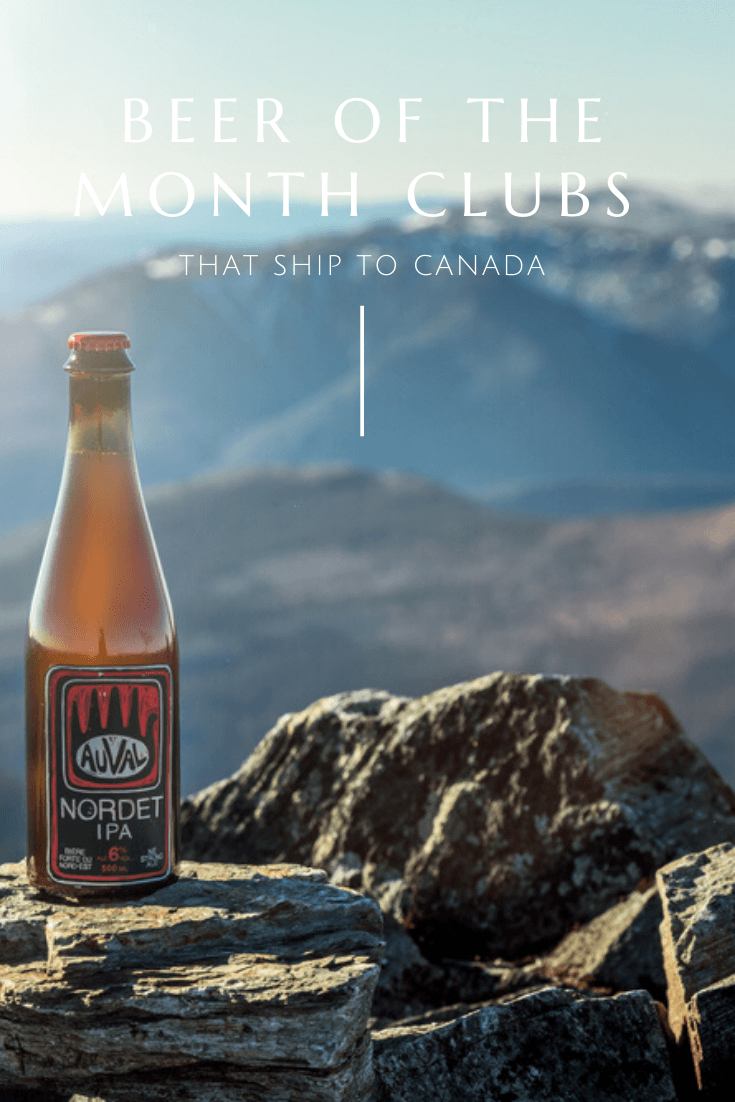 canadian beer sitting on rock in front of famous Canadian mountain