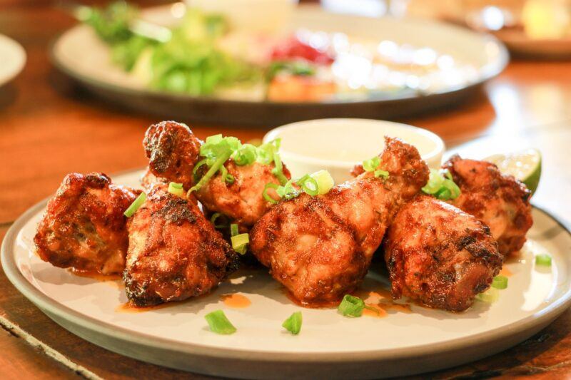 best-plant-based-chicken- | Food For Net a plate of chicken wings with garnishes to represent the best plant based chicken