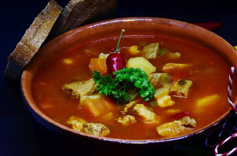 best-plant-based-frozen-meals | Food For Net a large pot of vegetable soup with garnish on top to represent the best plant-based frozen meals