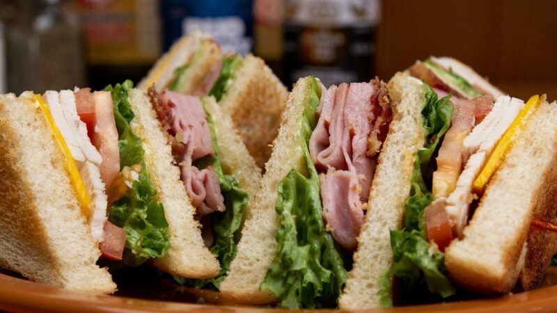 a close up of club sandwiches with meat slices to represent the best vegan lunch meat brands