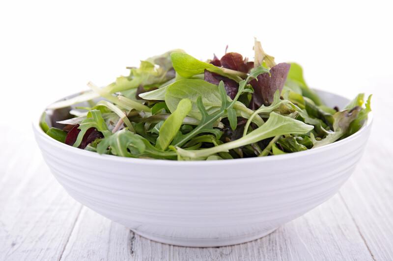 bowl of lettuce | Food For Net on a white wooden surface is a white bowl full of lettuce