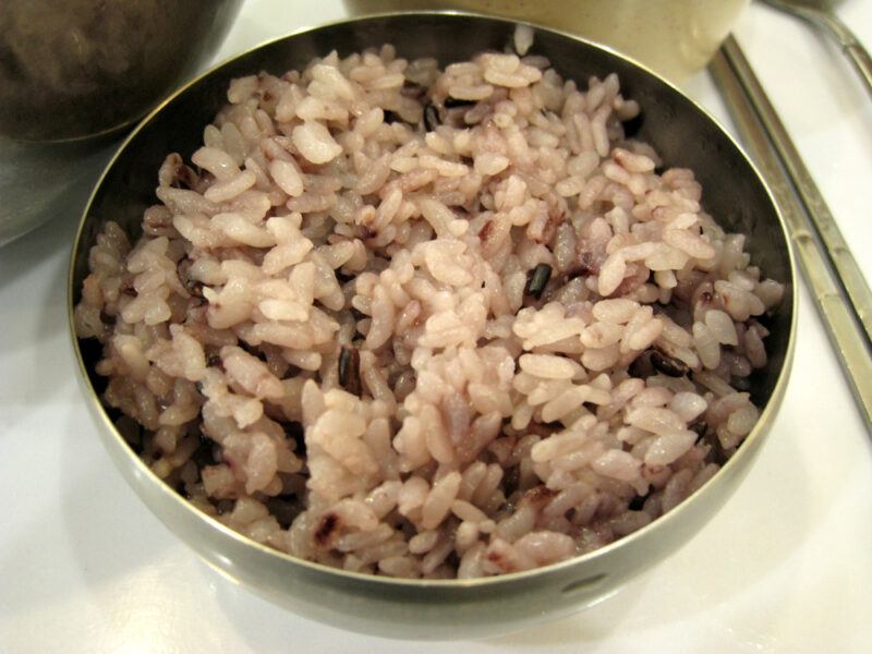 metal bowl full of cooked brown rice