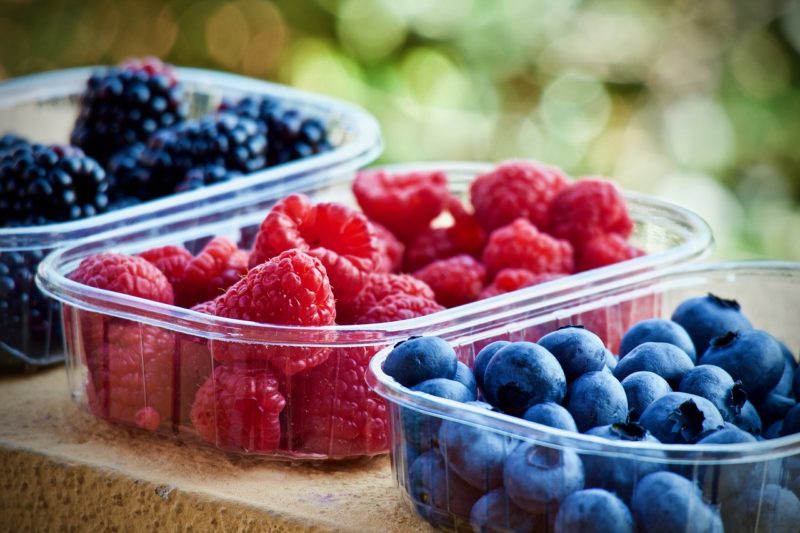 colorful berries sorted into containers to represent where to buy fresh berries online 