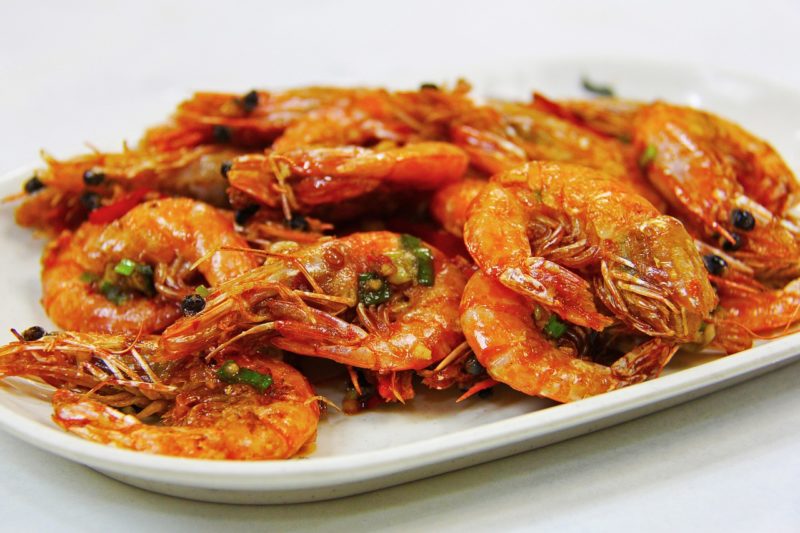 a plate of cooked and seasoned prawns to represent where to buy fresh prawns online 