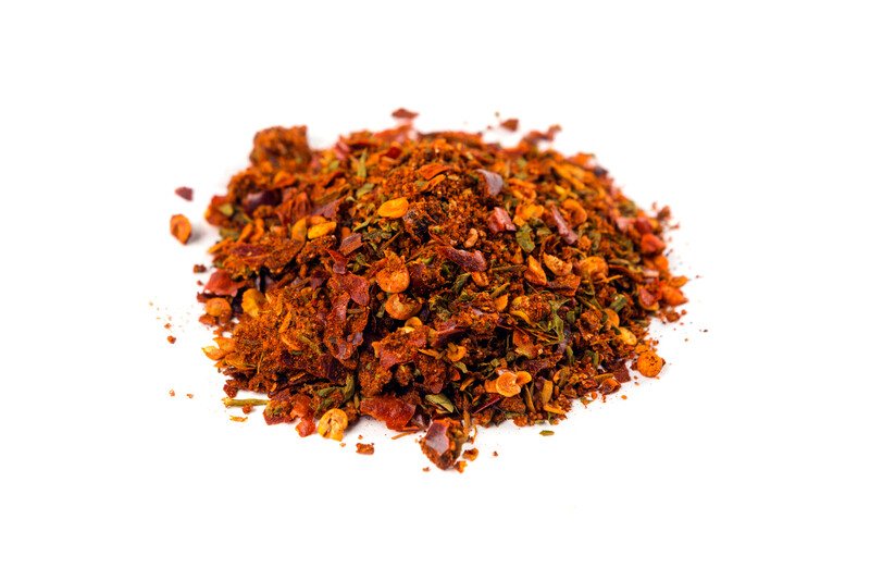 a heap of Cajun spice with white background