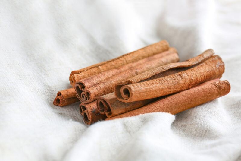 cinnamon sticks on a white cloth