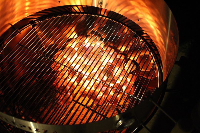 improper placement of grilling grates with kettlepizza (night photo with glowing coals)