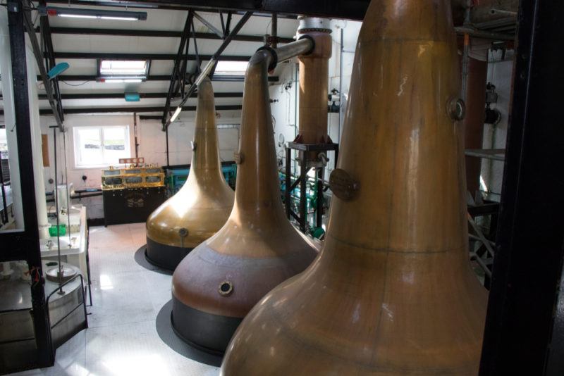 copper stills at Bowmore distillery islay scotland