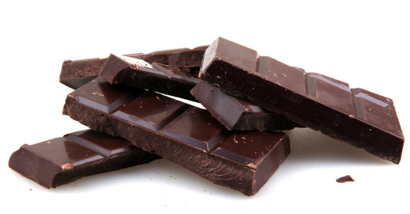 bars of dark chocolate on a white background