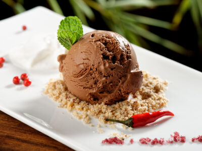 chocolate ice cream with chili pepper on serving dish