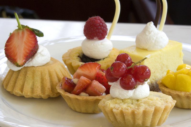 european style snack cakes with berries and cream on top