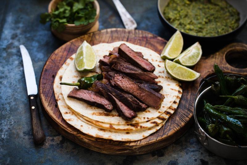 fire grilled skirt steak on flour tortillas with chimmicurri sauce and fire roasted peppers