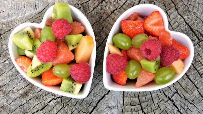 assorted fruits in two heart shaped bowls to represent fruit delivery services