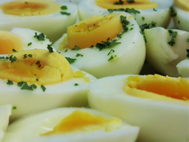 hardboiled eggs topped with parsley | Food For Net hardboiled eggs sliced in half and topped withminced parsley