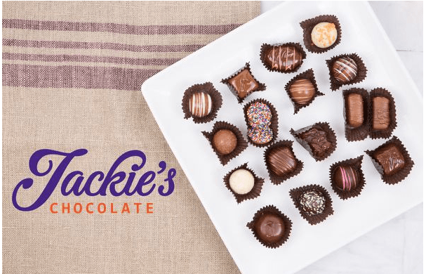 A white tray with various chocolates