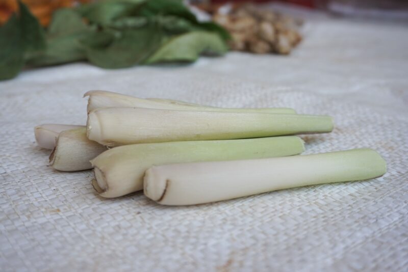 a closeup image of a small pile of lemongrass stalks