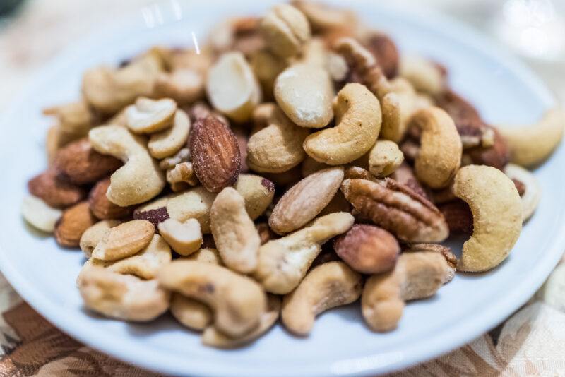 closeup image of a white plate with mixed nuts