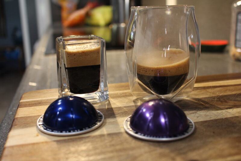 nespresso espresso pods in two types of glass coffee cups