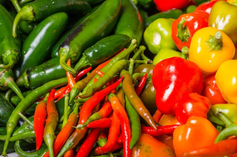 closeup image of a spread of different types of peppers