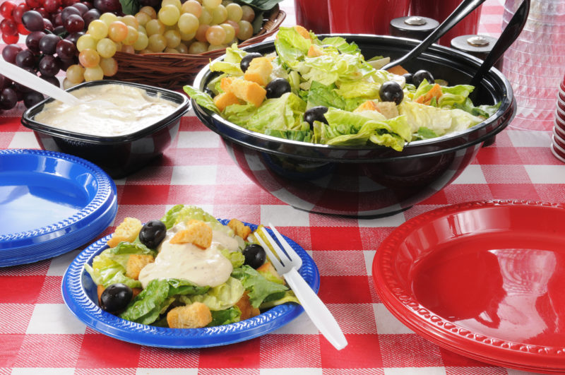 Fresh salad with lettuce, olives and croutons with a mayonnaise dressing.