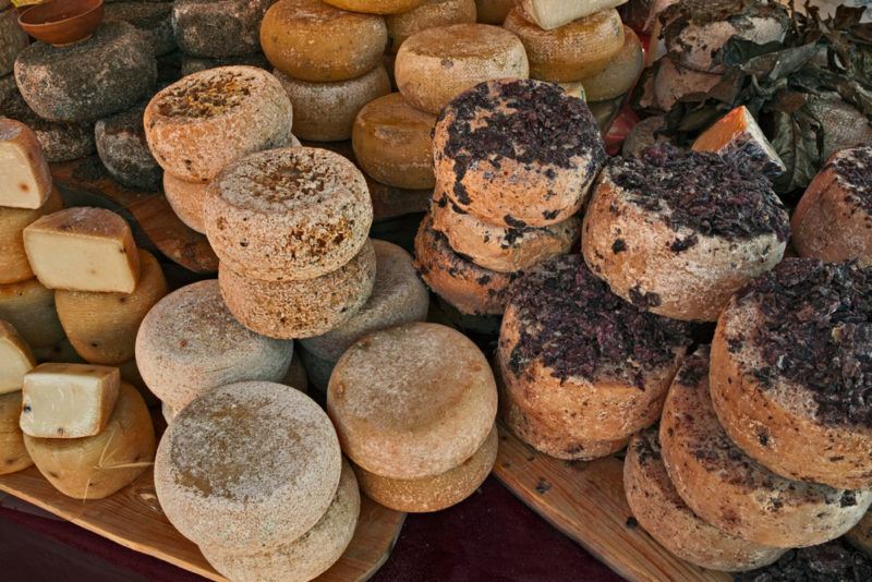 ripe sheep's milk cheese from Piedmont, Italy - typical traditional artisan dairy product aged with grape marc