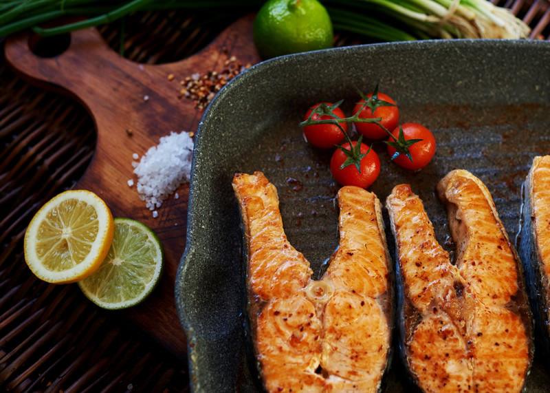 grilled salmon on smokeless indoor grill with cherry tomatoes showing a nut-free dinner safe for people with nut allergies