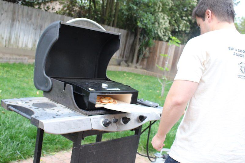 putting fried egg pizza into bakerstone box