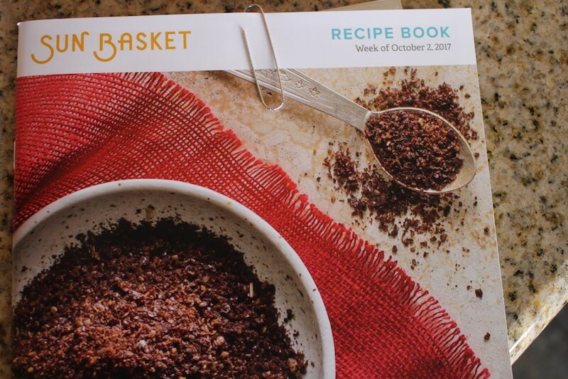 sunbasket recipe book featuring all recipes for the week, with a picture of spices on the front of book