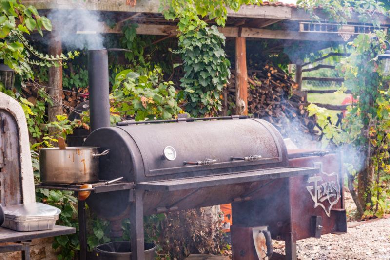 texas style smoker in rugged back yard