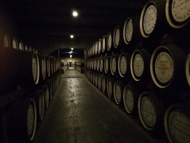 the-best-macallan-whiskey | Food For Net two long rows of whiskey barrels in a cellar to represent the best macallan whiskey