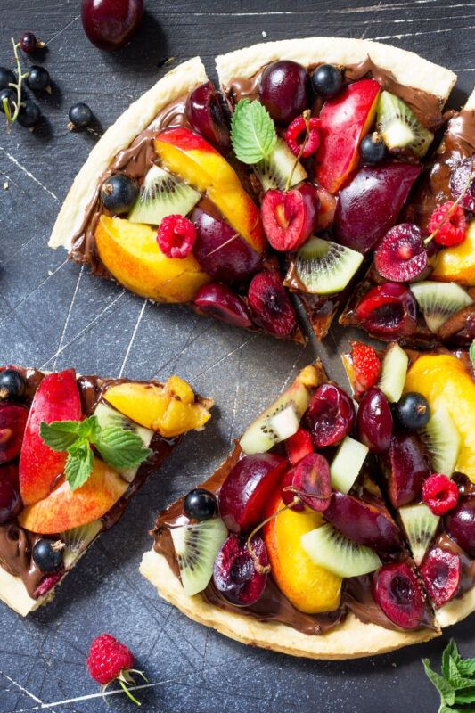 weird pizza with chocolate sauce and fruit